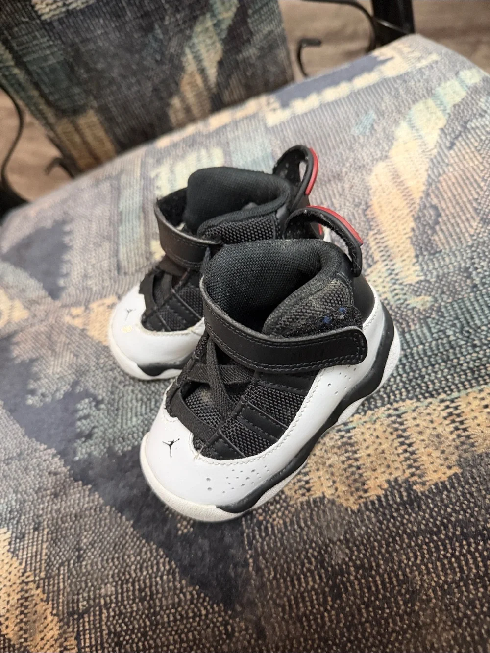 Jordan Kids Black and White High-Top Sneakers with Red Accent